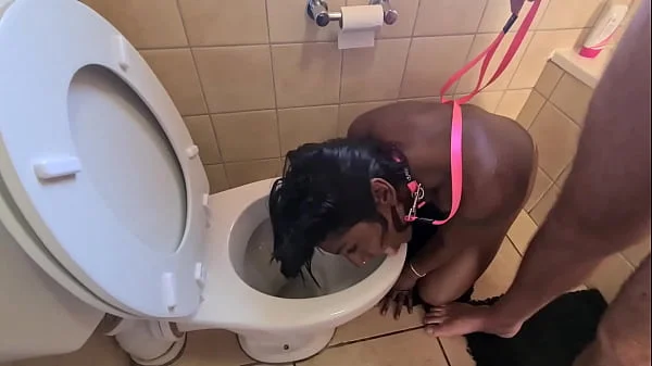 Desi whore gets walked like a to the toilet to get her face pissed on and sucks cock